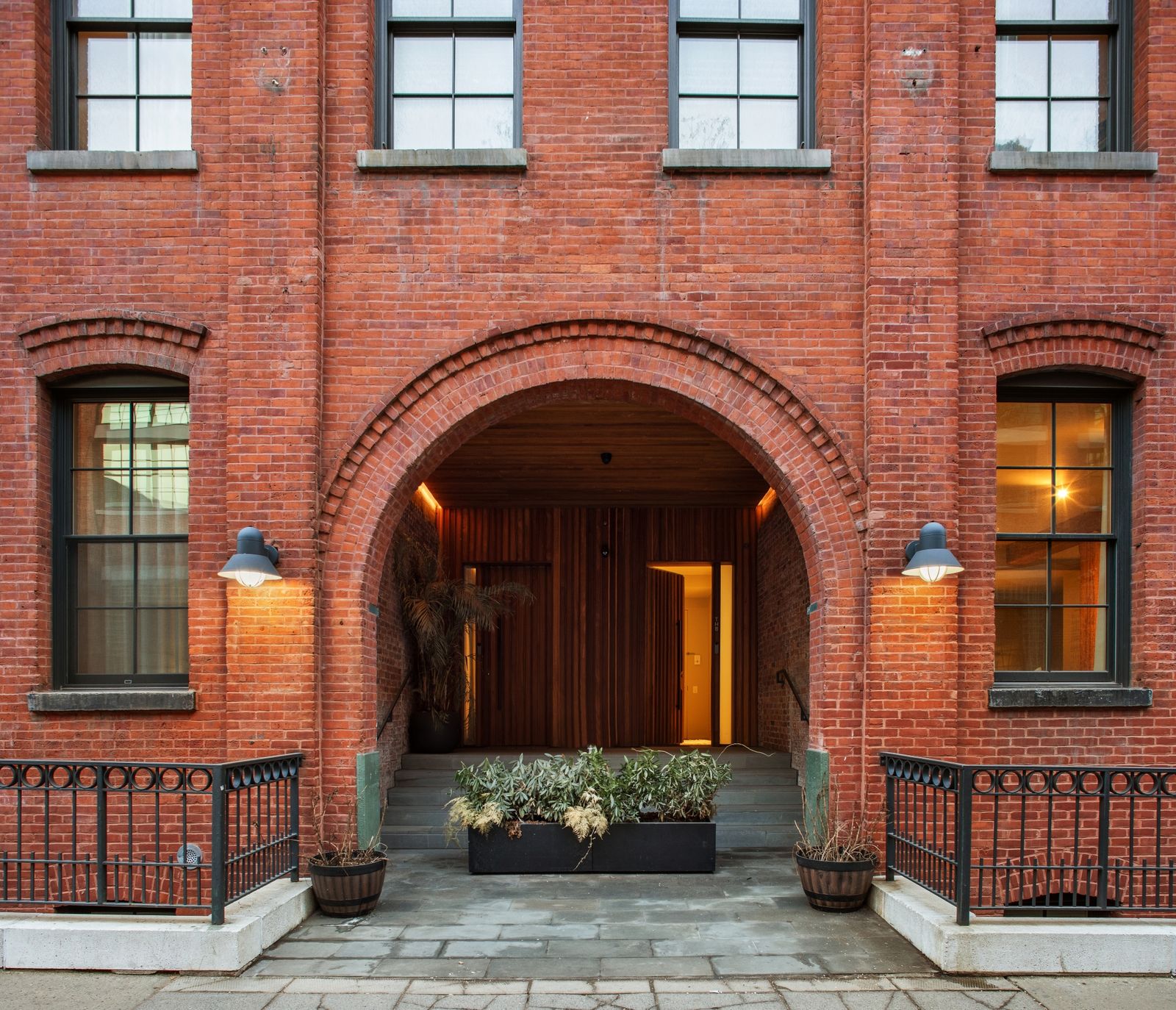 Set in Dumbo’s Brick and Timber building, the two-floor residence has huge archways, a custom kitchen, and a roof deck.