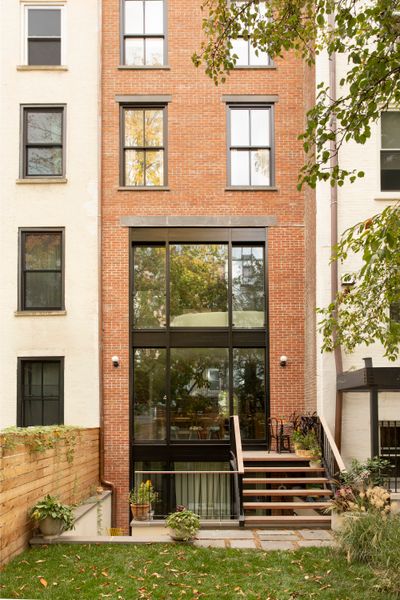 From the yard, the sunken seating space appears tucked away.