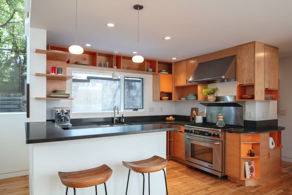 Both the study and the kitchen feature Kerf cabinetry and shelving.