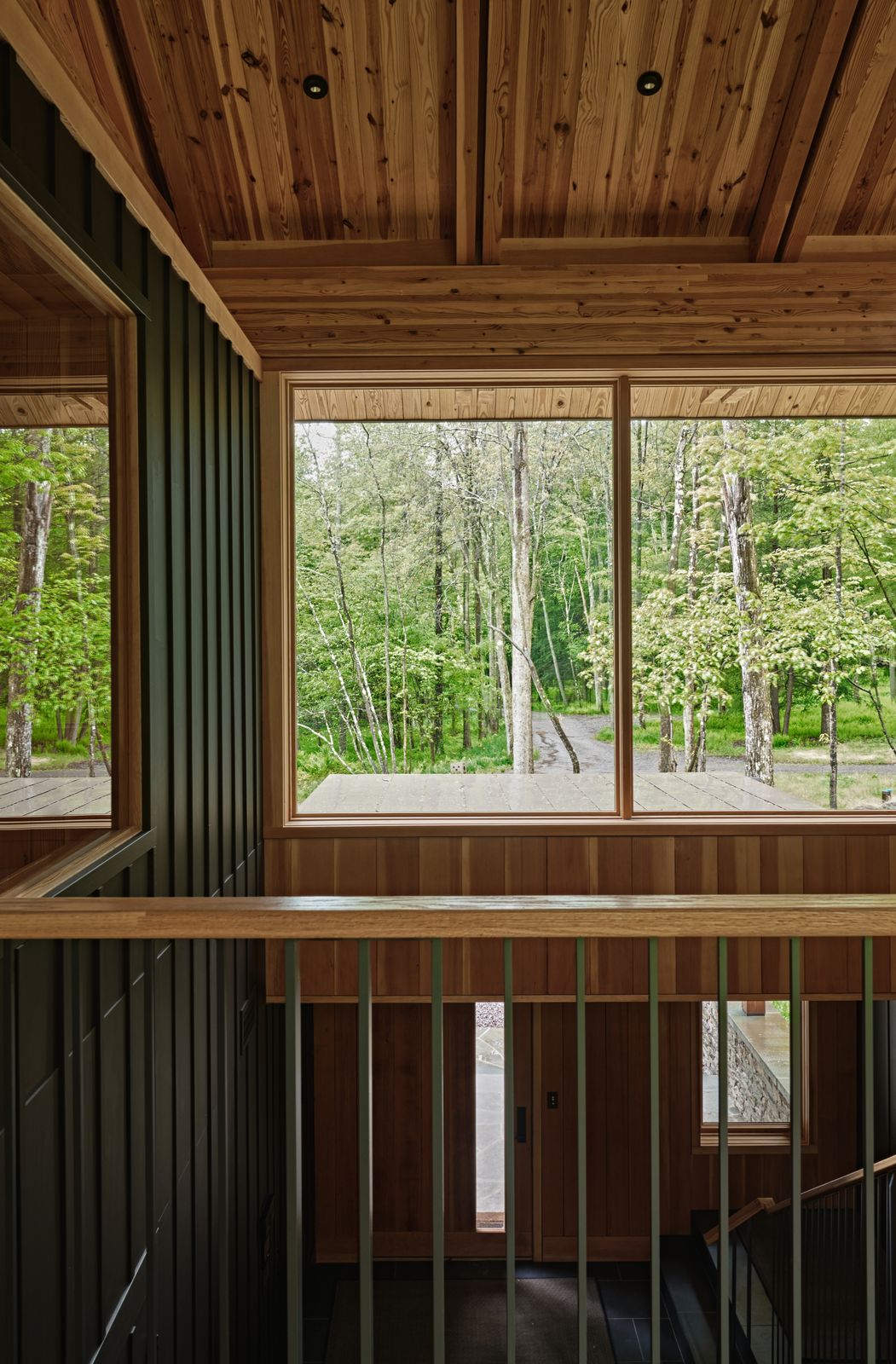 The stair hall creates a natural flow from the lower level to the airy upper volume. 