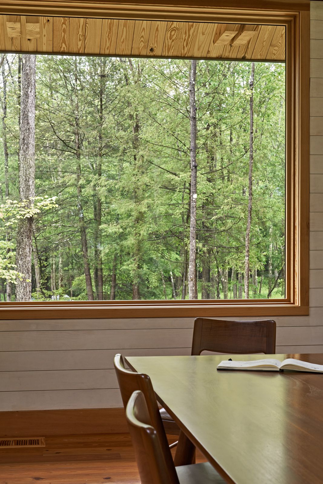 The window frames are crafted from the same Douglas fir as the ceiling and other interior details, minimizing visual distraction and allowing the views to take center stage.