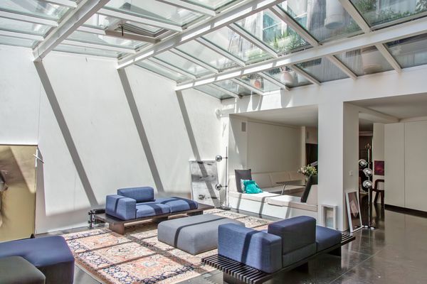 The full-length glass roof welcomes natural light throughout the day