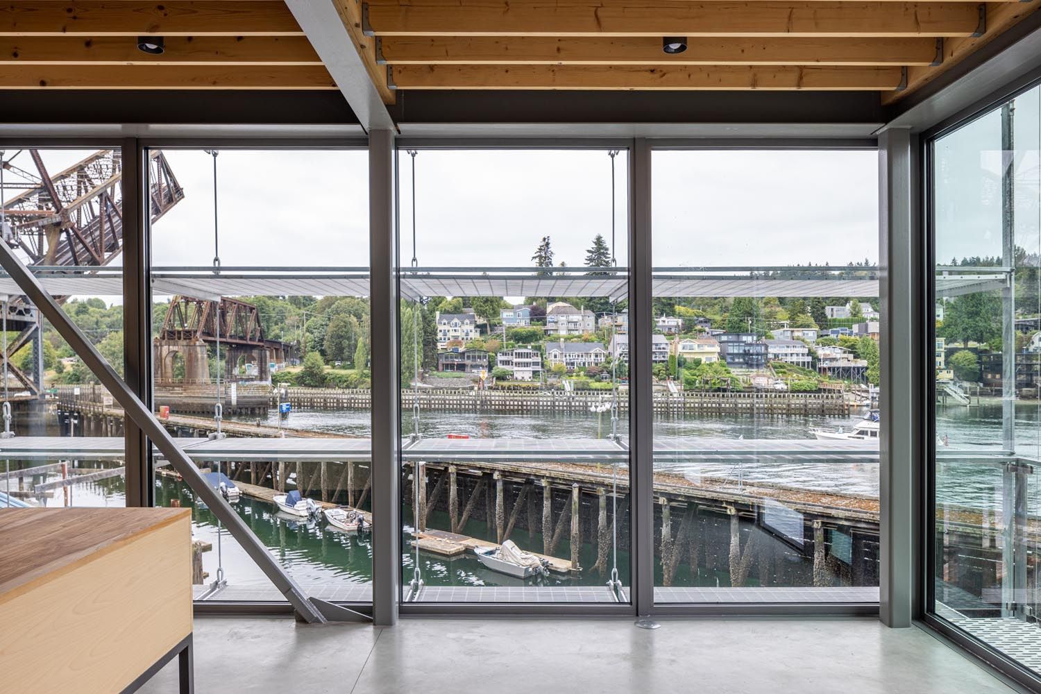 Large windows highlight the view of the harbor.