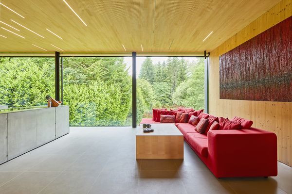 Floor to ceiling windows run along one entire wall of the common area.