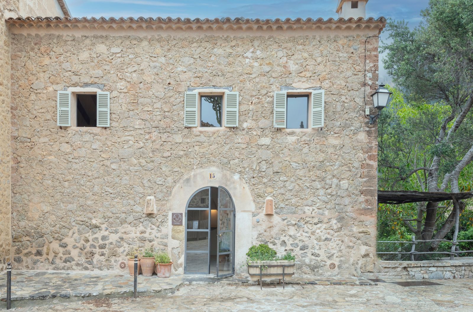 MoreDesign took this 19th-century structure down to the studs and rebuilt it with reclaimed stone, lime mortar, and locally made fixtures.