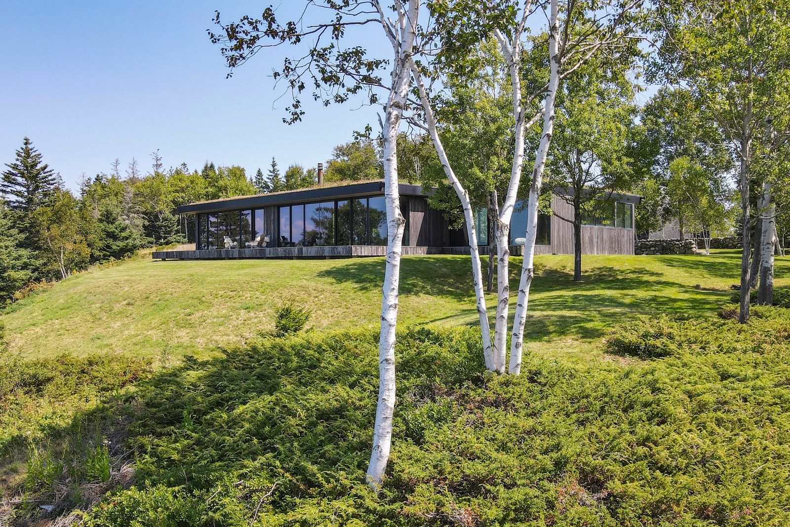 Designed by Toshiko Mori, this North Haven home is topped with a green roof, and it comes with a pool, a guesthouse, and 25 acres.