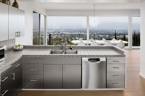 The revamped kitchen overlooks the dining area and epic L.A. views.