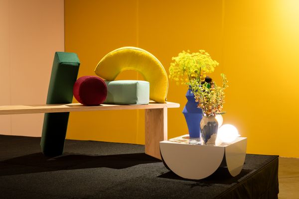 Geometric pillows by Portland, Oregon, studio Thatcher, perch on a bench by Seattle’s Fin, while vases by Hop &amp; Jans Studio and Tori Shao x Leo Shallat sit on a side table by Fruitsuper.
