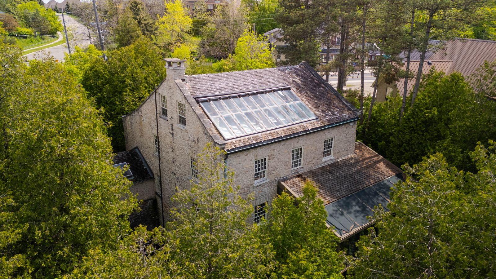 The $3 million building was converted into a home in the ’80s—and it has original woodwork and stone walls, a pool, and a huge bespoke kitchen.