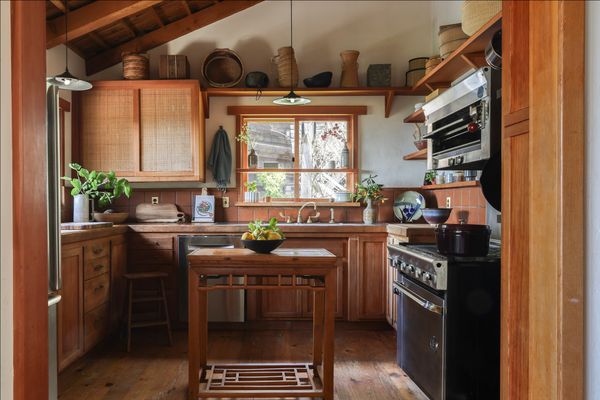 The Douglas fir cabinetry in the kitchen in the main house is original, built in 1982. So is the tile backsplash, the faucet, and the range.