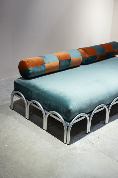 <span style="font-family: Theinhardt, -apple-system, BlinkMacSystemFont, "Segoe UI", Roboto, Oxygen-Sans, Ubuntu, Cantarell, "Helvetica Neue", sans-serif;">The Landing Sofa is part of the All Other Passports collection, launching later this year. Its curved arches, made of stainless steel, evoke the city (New York, hello), and the checkerboard bolster pillows can be also used as an armrest. </span>