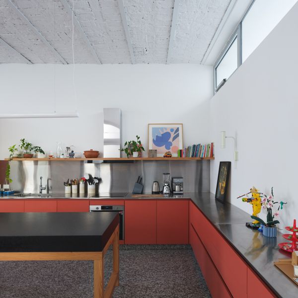The heart of the home is a spacious kitchen, built under the existing bovedilla ceiling, a method of construction that was popular in the region in the early 20th century, with rows of shallow brick walls set between exposed steel beams.