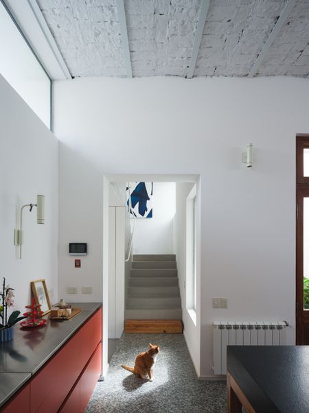 A view of the staircase leading up to the second floor, where the architects built a home office for Julián Romera, an art director, as well as a primary suite and a bedroom for the couple’s son, Félix.
