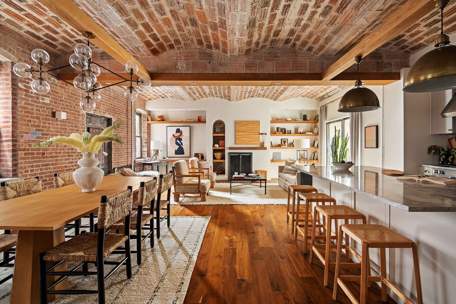 This charming 1905 flat in the West Village has a revamped kitchen, wide-plank hardwood floors, and a series of Juliet balconies.