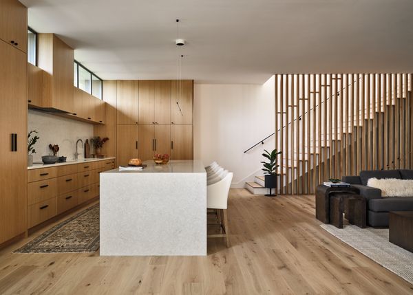 A peek into the kitchen and living area of the duplex located on site.