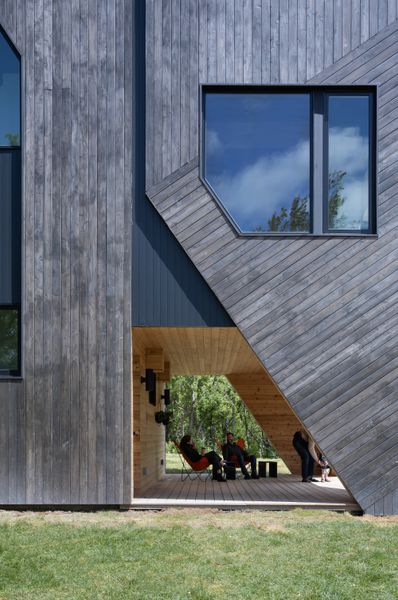 With large openings on three sides, Brooks says it’s almost like a 180 degree view. And while traditional porches might feature railings, they kept the edges wide open to enhance clear views in all directions.