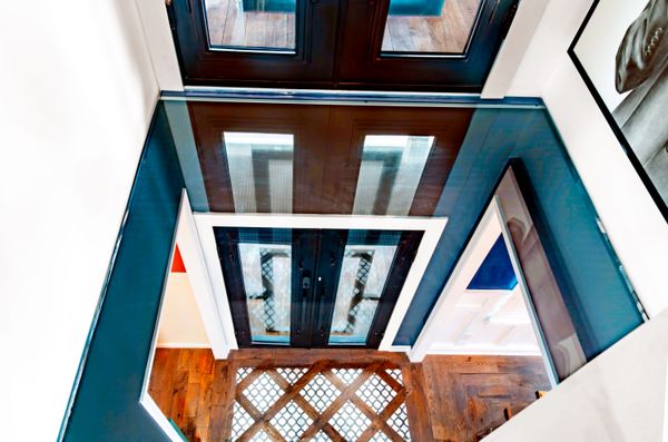 The glass floor above the foyer is eight inches thick.