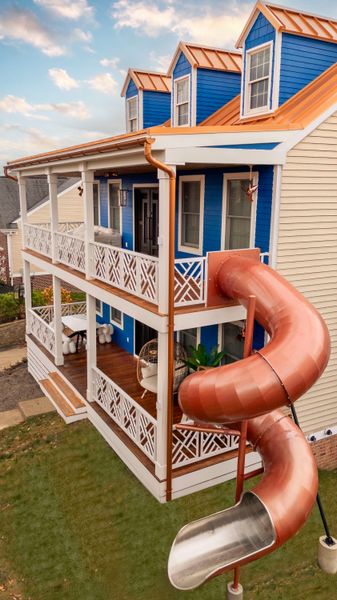 Morgan Kumpfmiller, founder of design-build firm American Dreamers Renovations, renovated her home to include a massive copper spiral slide, which was sourced from China.