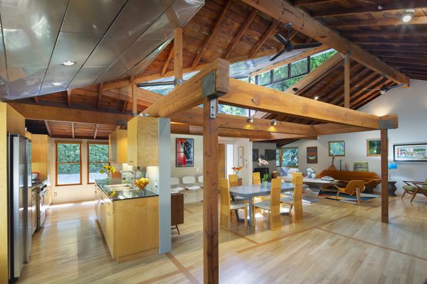 The home's previous walls are memorialized by darker marks in the flooring.