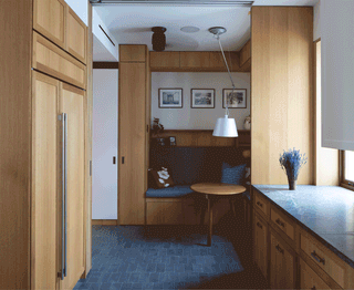 A breakfast nook transforms into a private sleeping space thanks to some clever interventions.