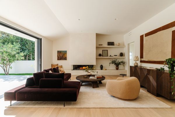 The open-concept living room sits at the heart of the home, with the four bedrooms centering around the space.