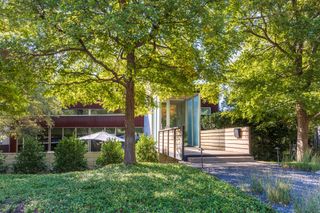 Cross the Bridge to Enter This $1.4M Dallas Home Wrapped in Cor-Ten Steel