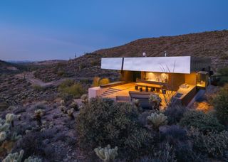 Topped With a Massive Metal Roof, a Futuristic Desert House Seeks $2.1M