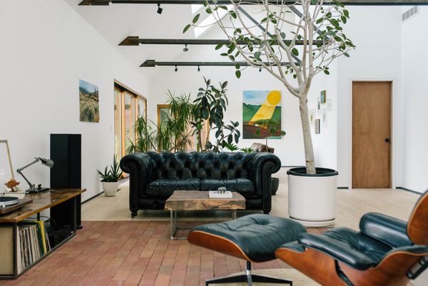 Local ash hardwood was used for the flooring, with brick paver and concrete accents breaking up the rooms.