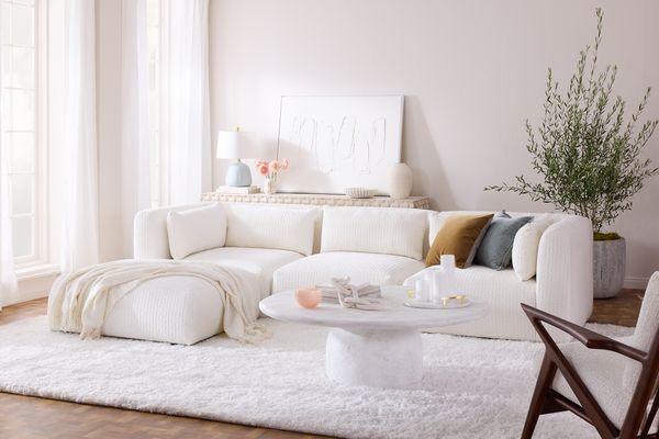 Joybird, a home decor brand owned by La-Z-Boy, released a three-piece furniture set in Cloud Dancer, including this sofa and ottoman.