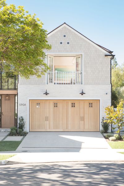 Light stained wood works well on a more farmhouse or traditional style home, as seen in this project in Newport Beach, California.