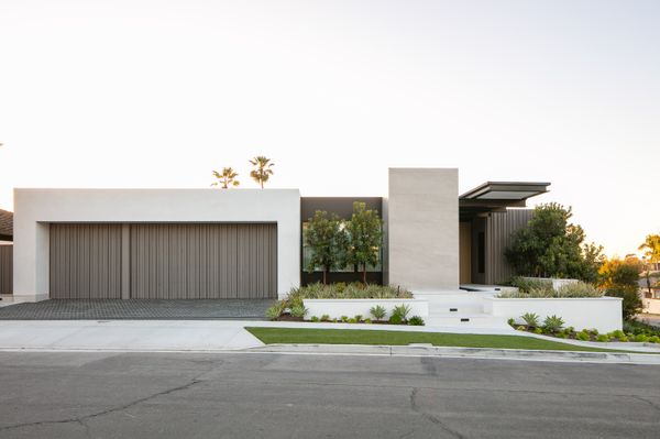 This Corona del Mar project, dubbed Serena Terrace by Brandon Architects, uses Azek TImberTech to make a garage door that's contemporary, durable, and modern.