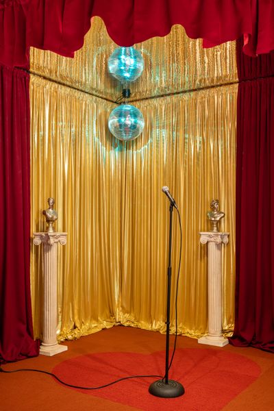 The home has a number of unique touches, including a stage they built in the living room for guests to do karaoke on, complete with a custom heart rug on top.