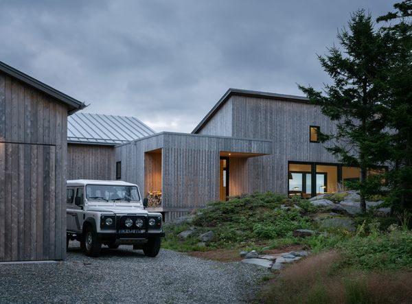 Each volume—a workshop, one for the primary suite, another for the living space, and a screened porch—is 12 feet wide, a limitation set by the site and by what was possible to bring over by boat.