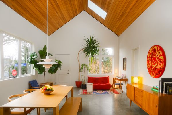 René Gauthier, Aki Kaltenbach, and six-year-old Hiro sit outside their home in Victoria, British Columbia, which architect Colin Harper designed in the spirit of the corner store that stood here before.