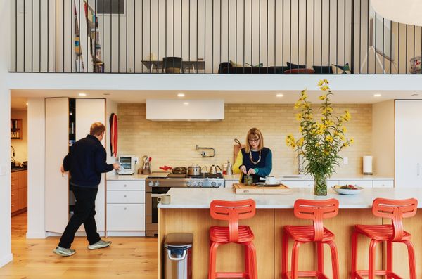 Space Theory designed the kitchen, which cost $50,000, with Carrara marble countertops and a built-in coffee bar; Dornbracht faucets and Dirk van der Kooij stools complete the space.