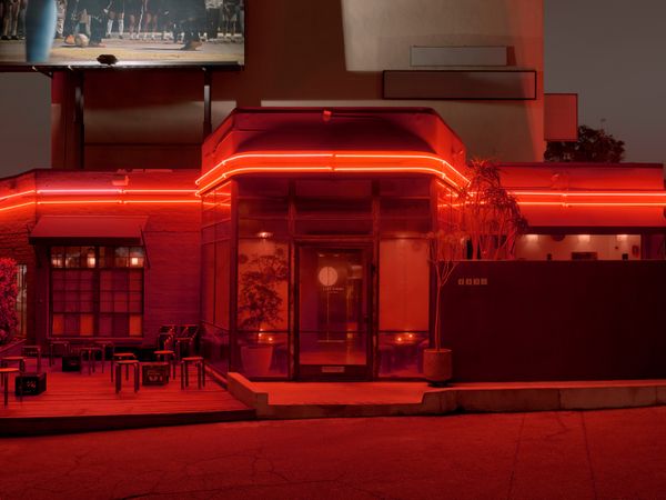 The eterior of Café Tondo makes an impression with its bright red neon lights.