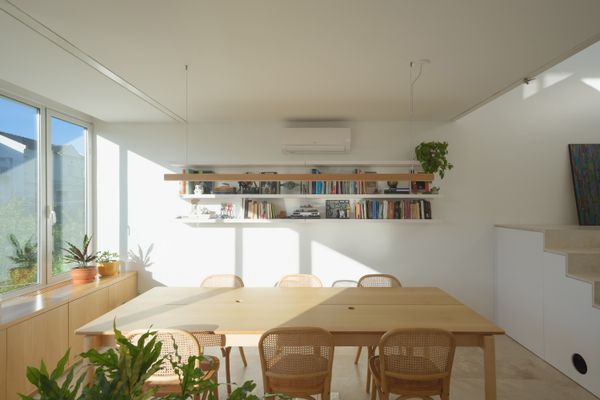 The couple’s studio is on the first floor. The pendant is by Clic, and the table is by Estudio Te.