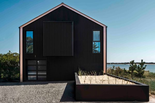 Black-stained hemlock clads the front of the house for a more modern look.