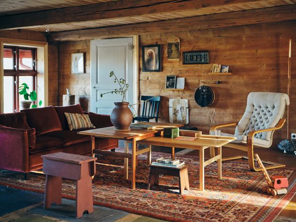 The living room has an Ikea Poäng chair from the 1980s and a vintage sofa sourced from Auktionet, among several other pieces the couple has collected over time.