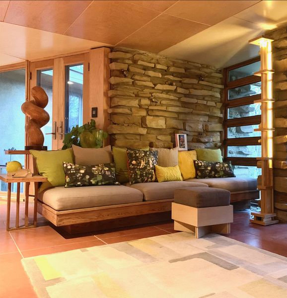 According to renovation architect Joe Kuspan, the restoration was designed to unify decades of exterior modifications while allowing old and new elements to remain distinct inside. The material palette follows the home’s 1940 language of plywood, 1-by-2 pine trim, colored concrete floors, cypress, and stone.