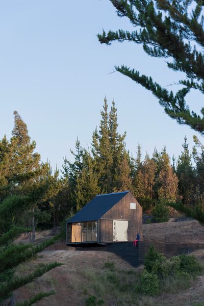 This 376-square-foot cabin in Matanzas, a rugged coastal area of Chile popular among kite surfers, was designed by local studio Stanaćev Granados.