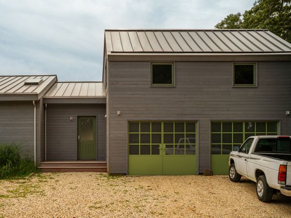 Architect Michael Campbell renovated an upstate New York retreat for a Brooklyn family. The garage was separate and had an illegal ADU upstairs, so Campbell built a foyer that connects it with the home.