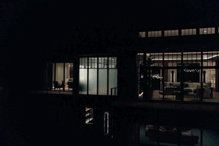 As evening settles over the lake, the 10-foot CLiC windows in the primary bath are seen shifting from clear to private mode.&nbsp;
