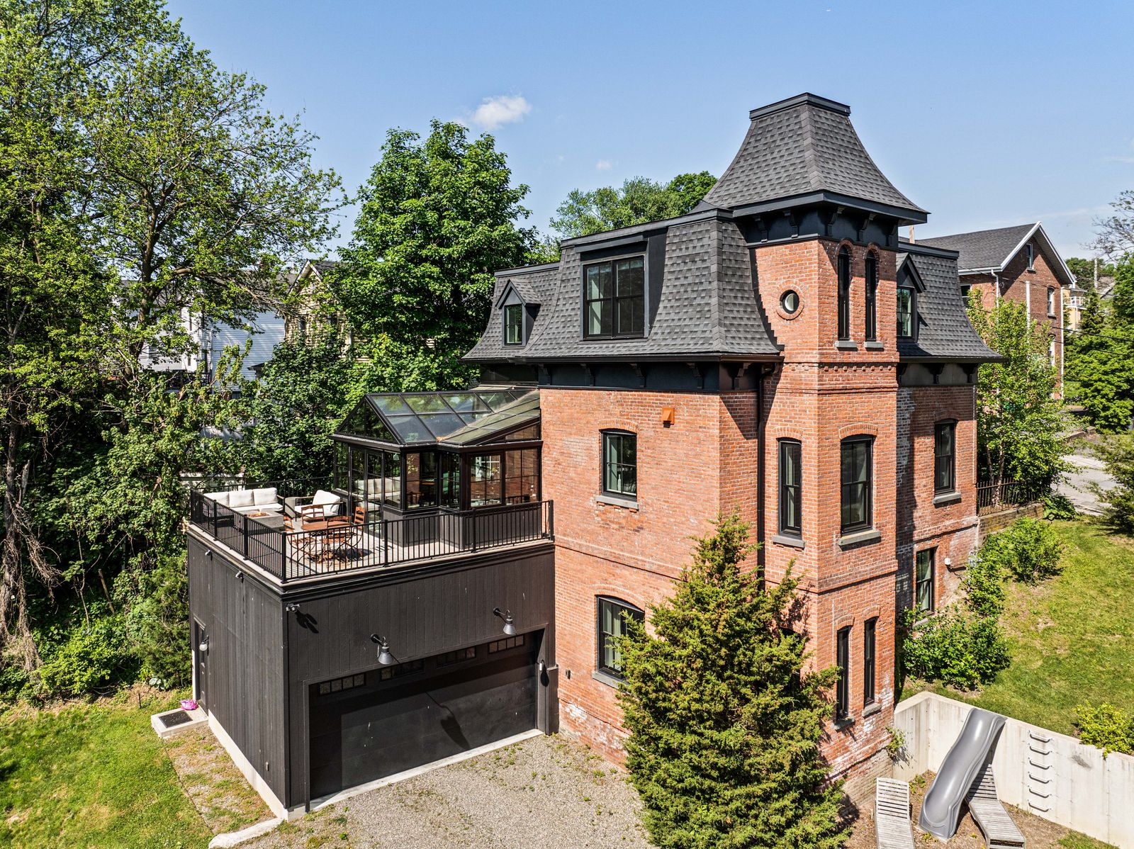 Built in the late 1800s, this restored Second Empire Victorian sits one block from the Main Street of Beacon, New York, with views of Fishkill Creek from its glassy conservatory.
