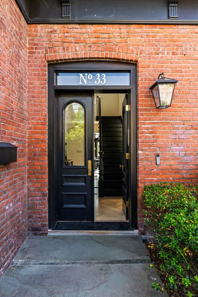 Built circa 1880, Rombout House is a brick Second Empire Victorian with a mansard roof, tower, and prominent corner setting in Beacon, New York.
