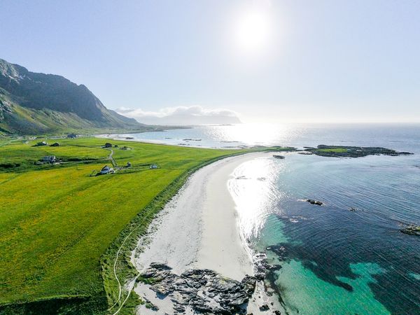 Built in 1950, the three-level home has been gently modernized over time, with white-painted paneling and simple rooms that keep its traditional Lofoten character intact.