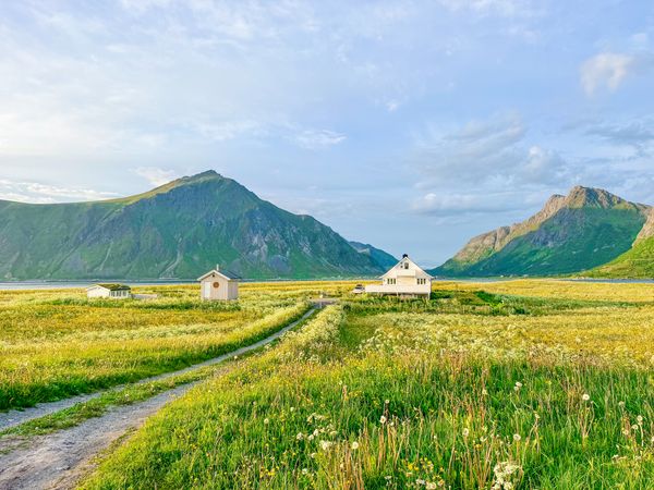 Built in 1950, the three-level home has been gently modernized over time, with white-painted paneling and simple rooms that keep its traditional Lofoten character intact.