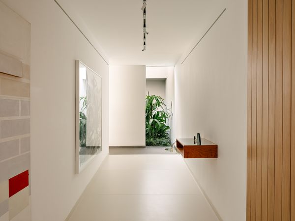 To the right, a corridor leads to the living spaces.