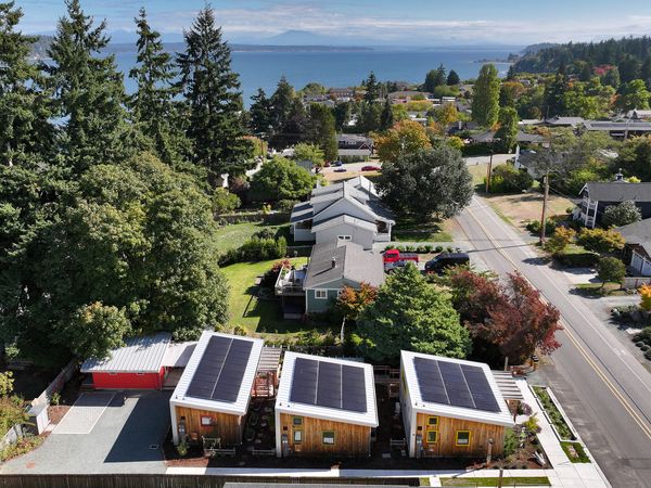 Each of the three homes was built to net-zero energy standards and topped with its own solar panels.