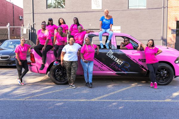 The ContractHer founder Tisha Jordan, in blue, with workshop participants.